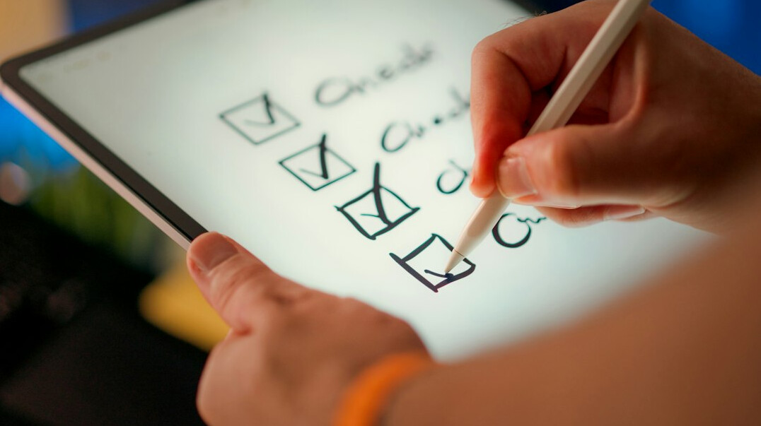 person filling out survey form